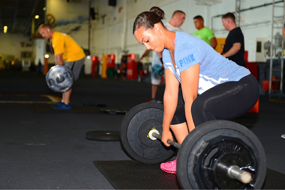 Alex Szabo Osteopathy - woman weight lifting